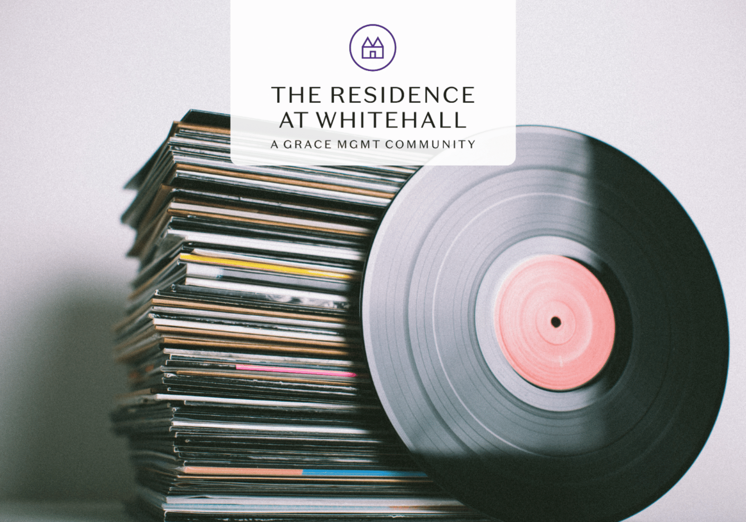 Brand banner over a stack of vinyl records promoting The Residence at Whitehall, a Grace Mgmt community (logo centered).