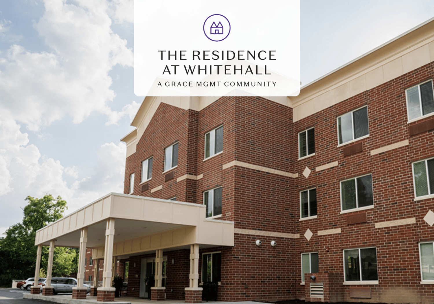 Exterior view of The Residence at Whitehall, a brick residential building with a covered entrance and a white promotional overlay featuring the logo and name.